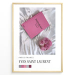 Indlæs billede til gallerivisning Fashion Plakat | Yves Saint Laurent Pink Book on Silk – Paris Fashion Decor Plakaty.dk | Yves Saint Laurent pink Catwalk book placed on white silk fabric with pink roses beside it, representing Parisian luxury and soft elegance.
